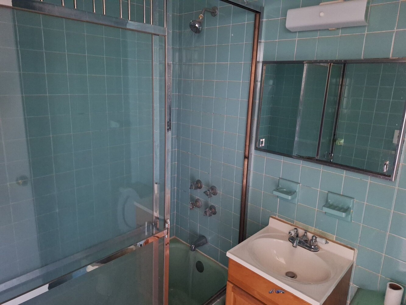 200 West 139th Street Manhattan, NY 10030 - Photo 16 of 24 a bathroom with a sink a toilet and shower