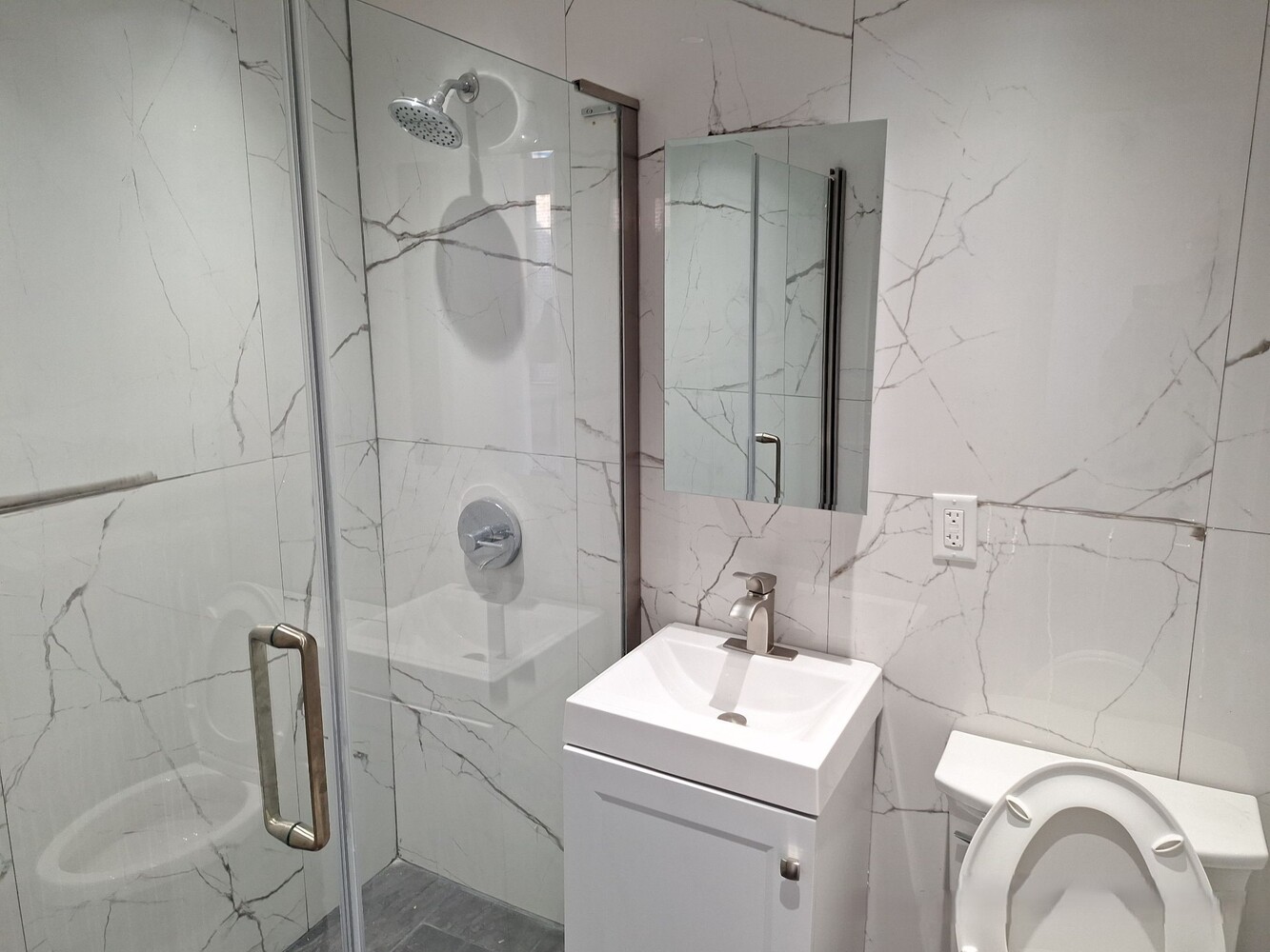 200 West 139th Street Manhattan, NY 10030 - Photo 19 of 24 a bathroom with a sink a toilet and shower