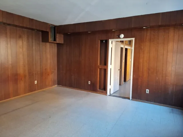 a kitchen with a refrigerator and a stove