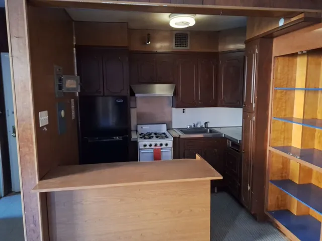 a view of a room with wooden walls