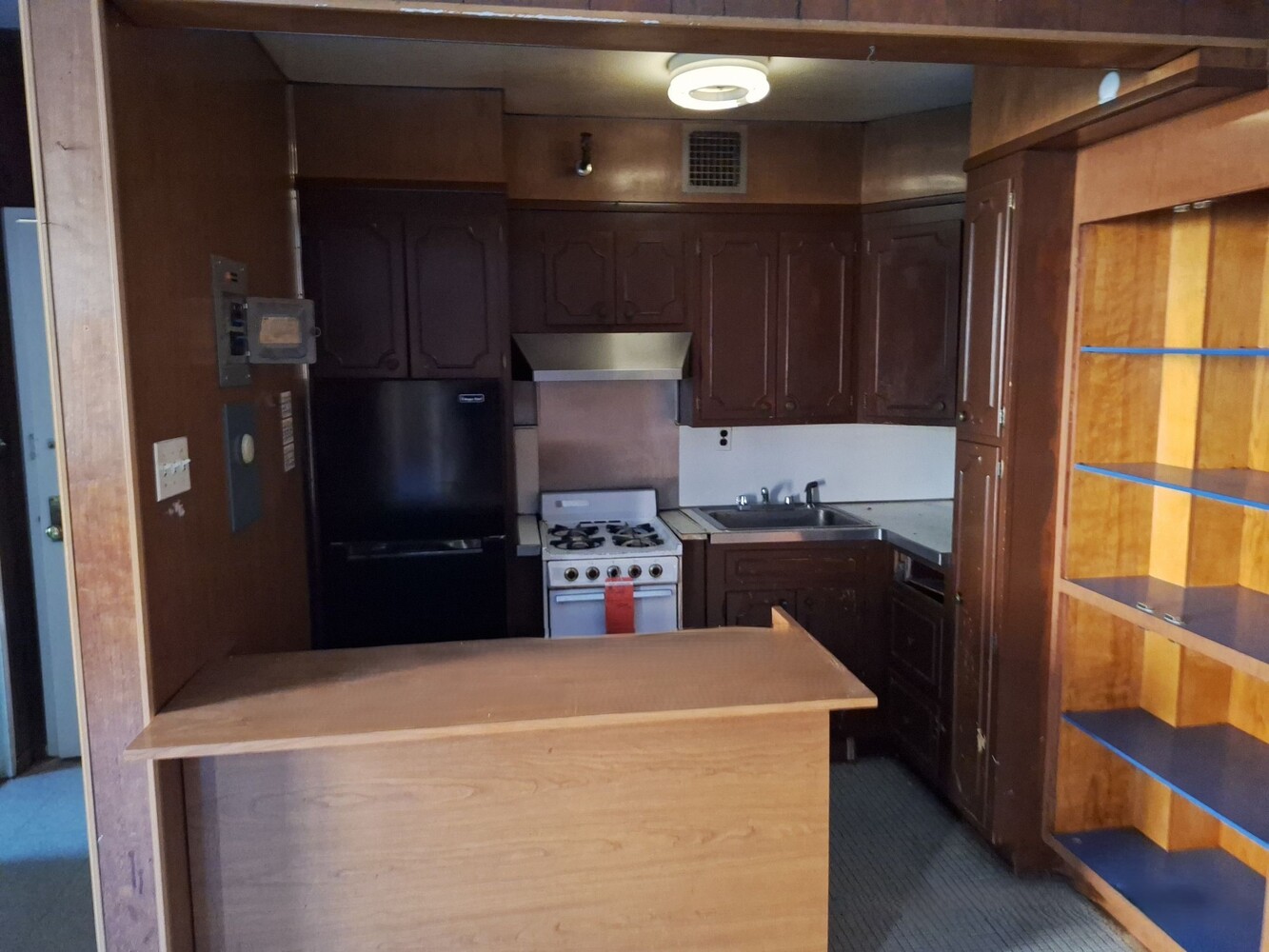 200 West 139th Street Manhattan, NY 10030 - Photo 4 of 24 a kitchen with a refrigerator and a stove