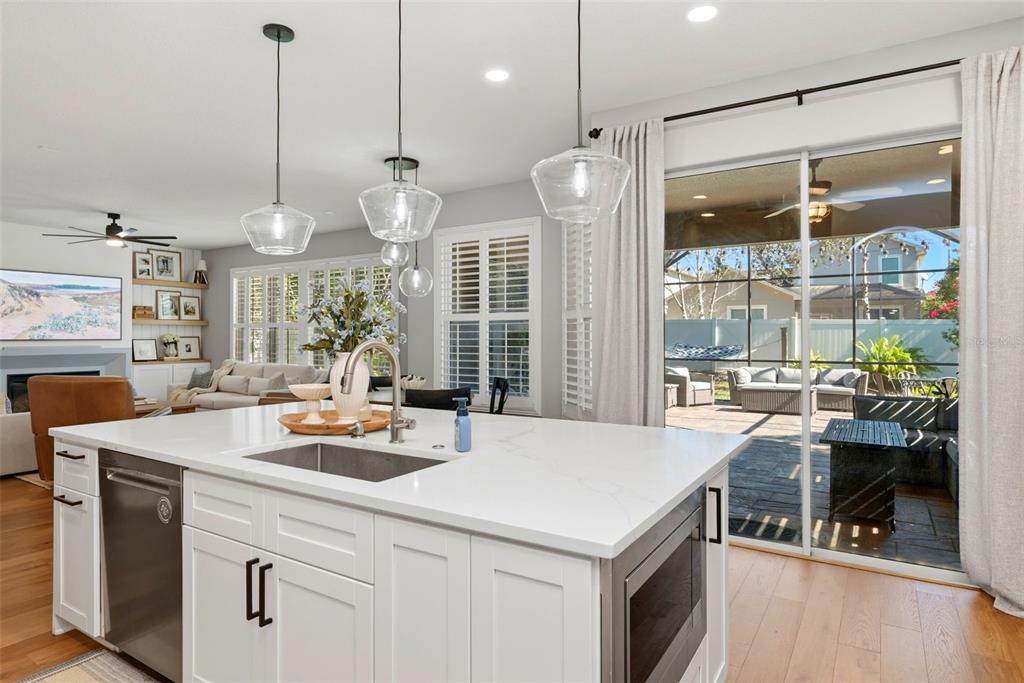 13912 Darchance Road Windermere, FL 34786 - Photo 22 of 49 a kitchen with a sink a counter top space and living room view