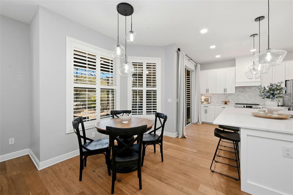 13912 Darchance Road Windermere, FL 34786 - Photo 23 of 49 a view of a dining room with furniture window and wooden floor