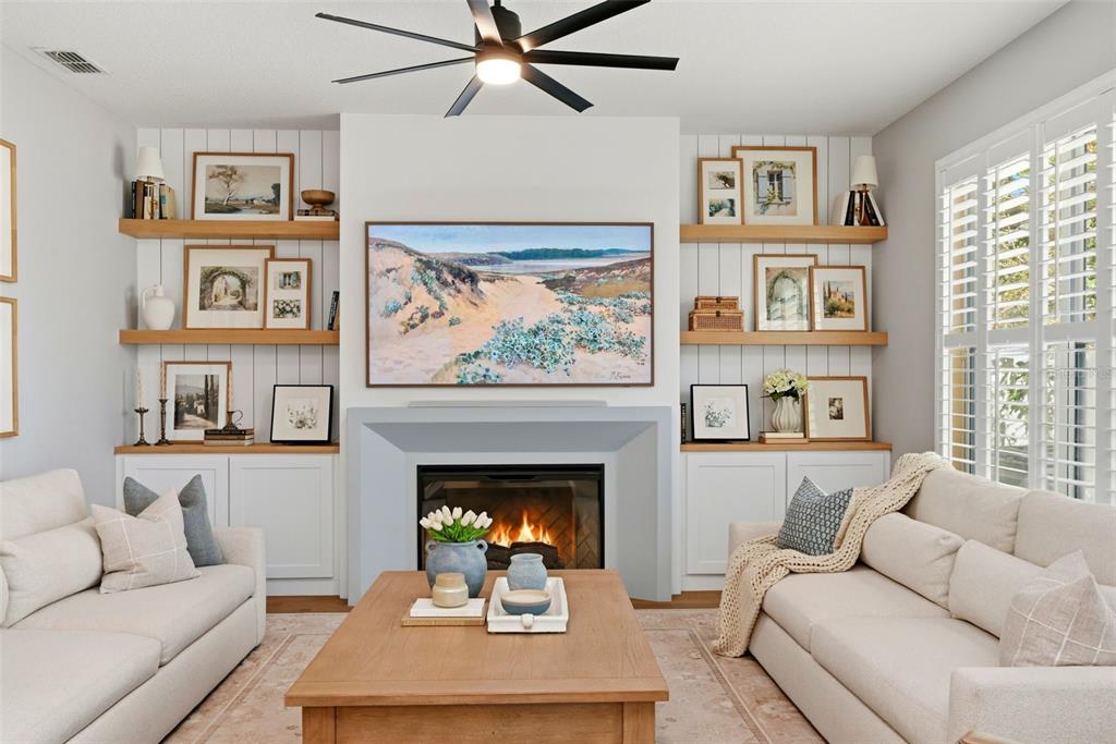 13912 Darchance Road Windermere, FL 34786 - Photo 27 of 49 a living room with furniture and a fireplace