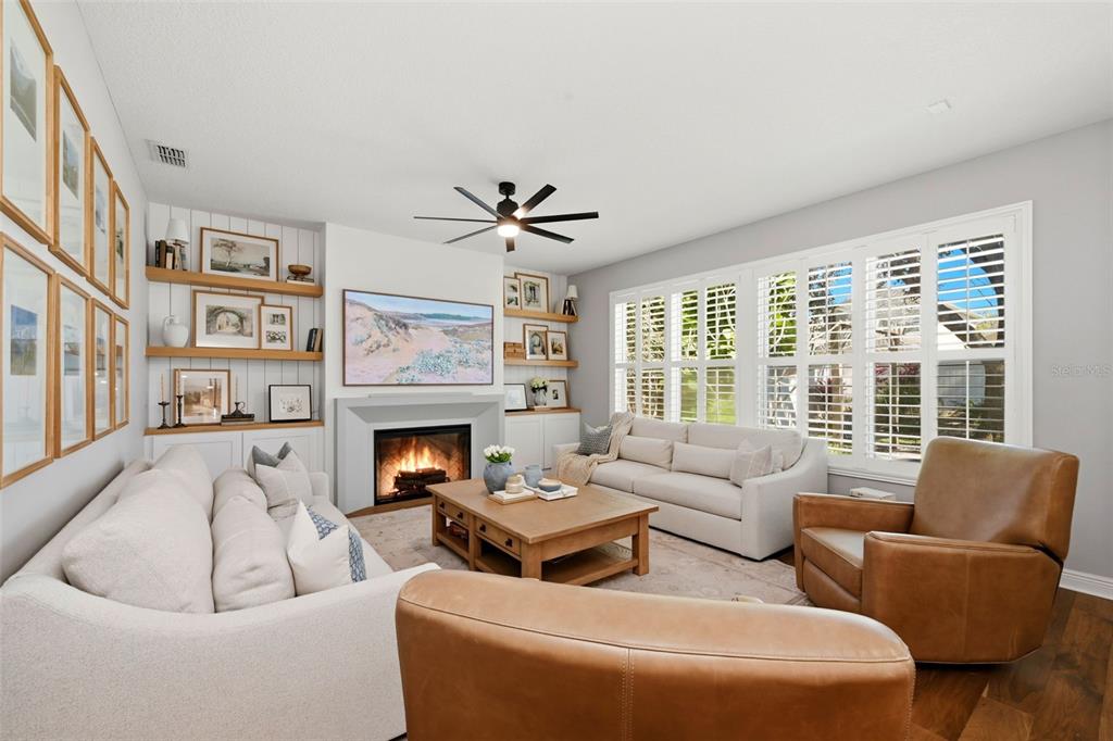 13912 Darchance Road Windermere, FL 34786 - Photo 28 of 49 a living room with furniture fireplace and a large window