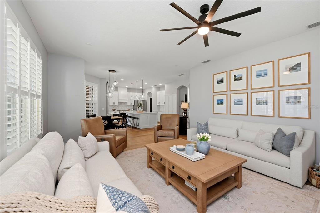 13912 Darchance Road Windermere, FL 34786 - Photo 30 of 49 a living room with furniture a table and a window