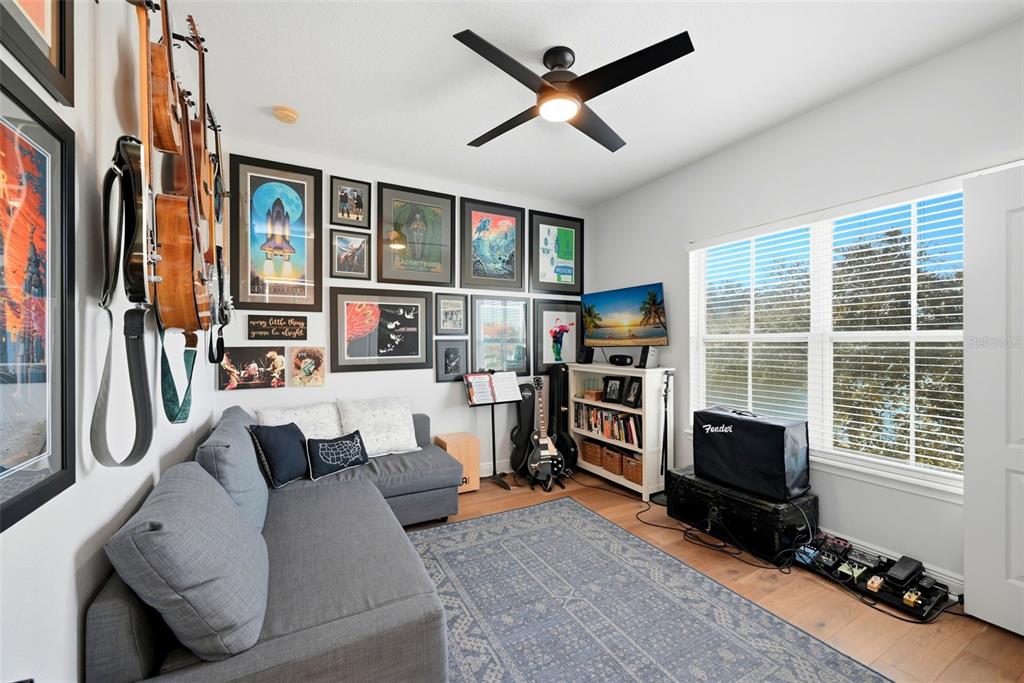 13912 Darchance Road Windermere, FL 34786 - Photo 34 of 49 a living room with furniture a flat screen tv and a large window