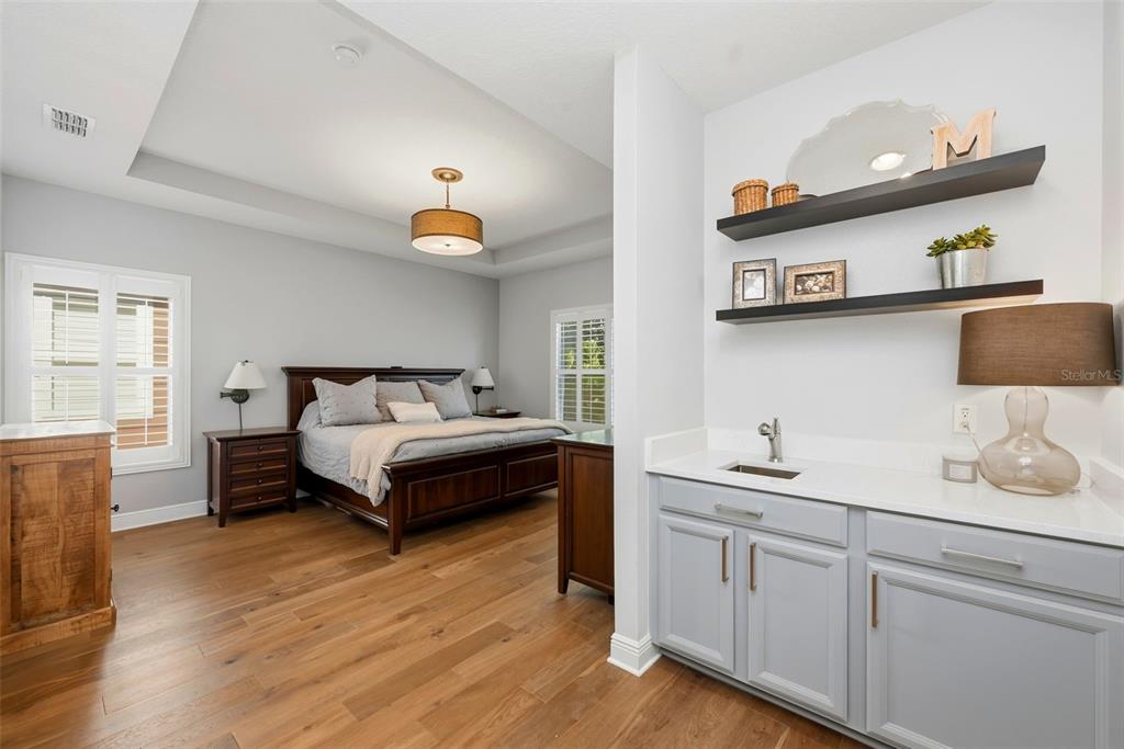 13912 Darchance Road Windermere, FL 34786 - Photo 36 of 49 a bedroom with a bed and wooden floor