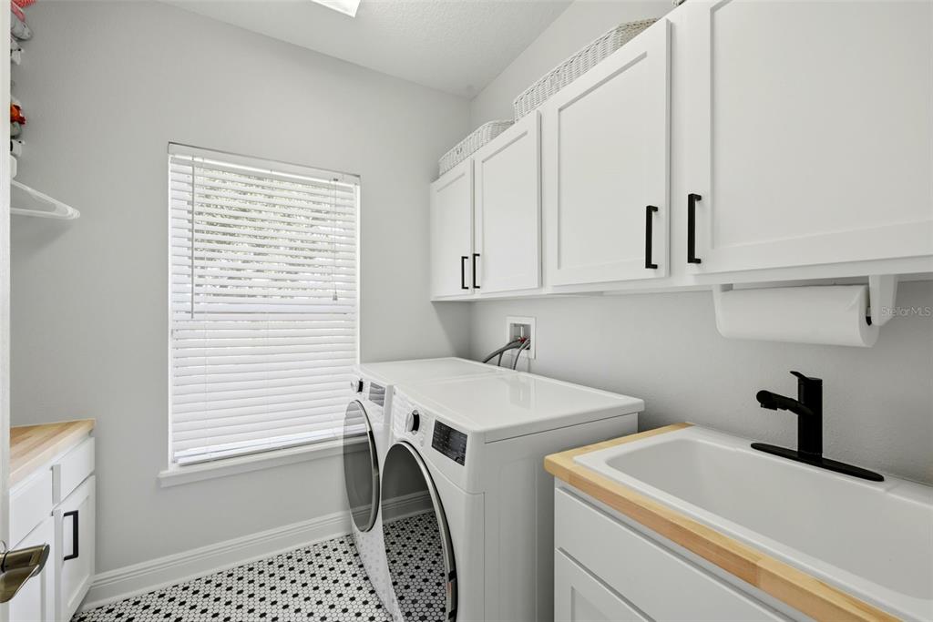 13912 Darchance Road Windermere, FL 34786 - Photo 46 of 49 a utility room with dryer and washer