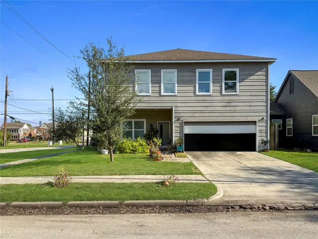 a view of a house with a yard porch and a fire pit