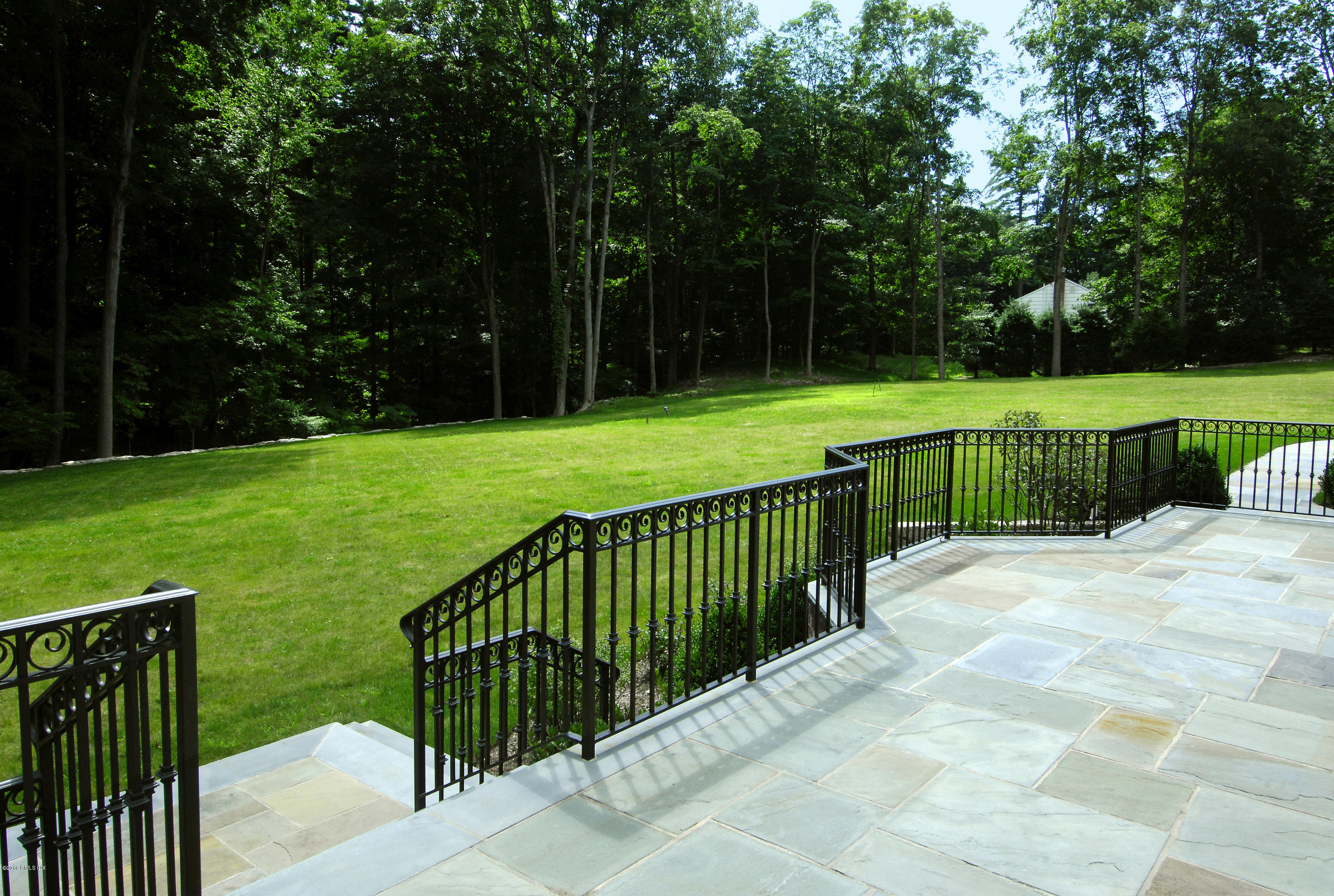 43 Burning Tree Road Greenwich, CT 06830 - Photo 13 of 24 a view of a deck with a backyard