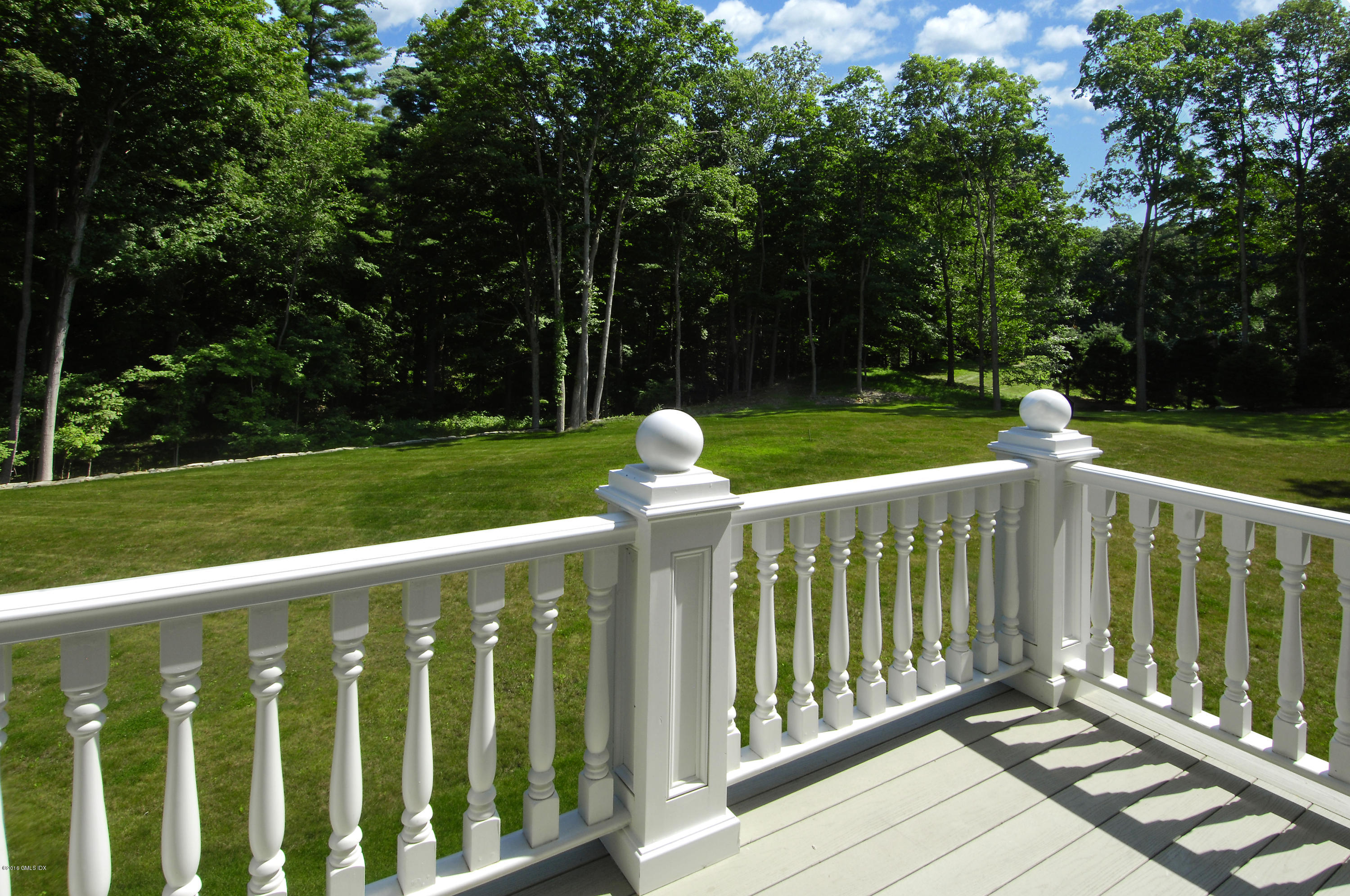 43 Burning Tree Road Greenwich, CT 06830 - Photo 19 of 24 a view of a deck with a small yard