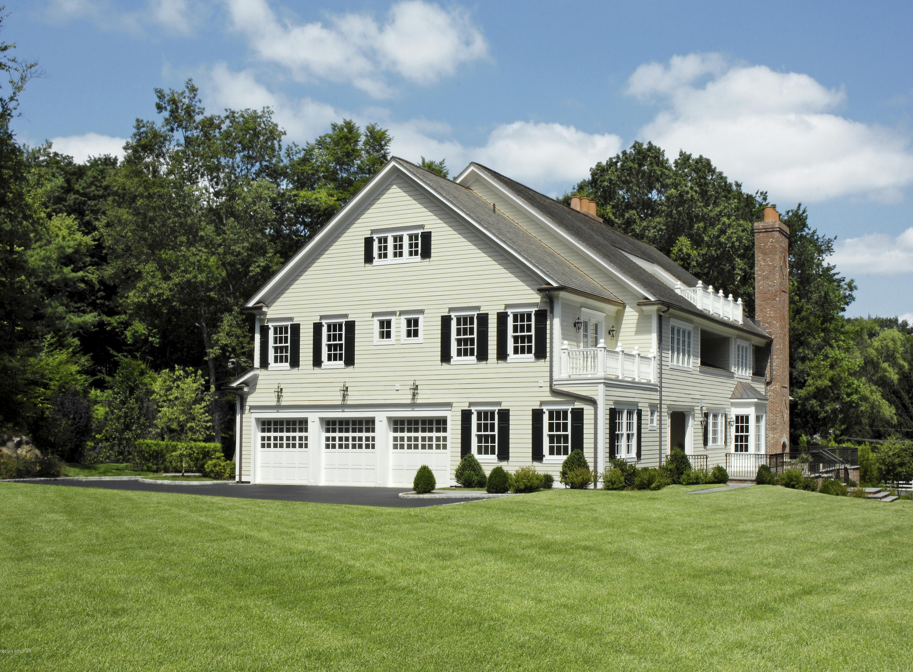 43 Burning Tree Road Greenwich, CT 06830 - Photo 20 of 24 a view of a house with a yard