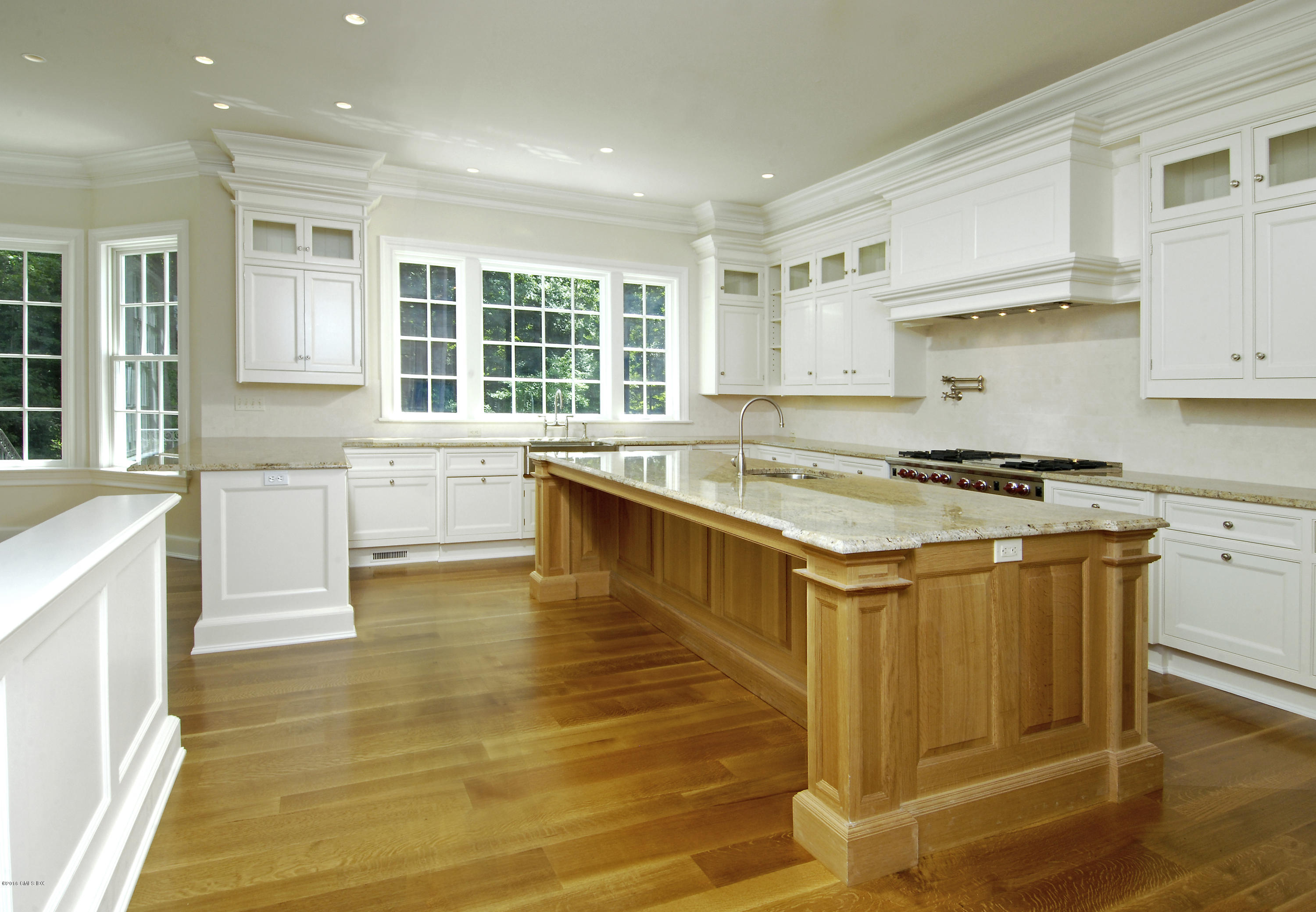43 Burning Tree Road Greenwich, CT 06830 - Photo 8 of 24 a kitchen with stainless steel appliances granite countertop a sink and cabinets