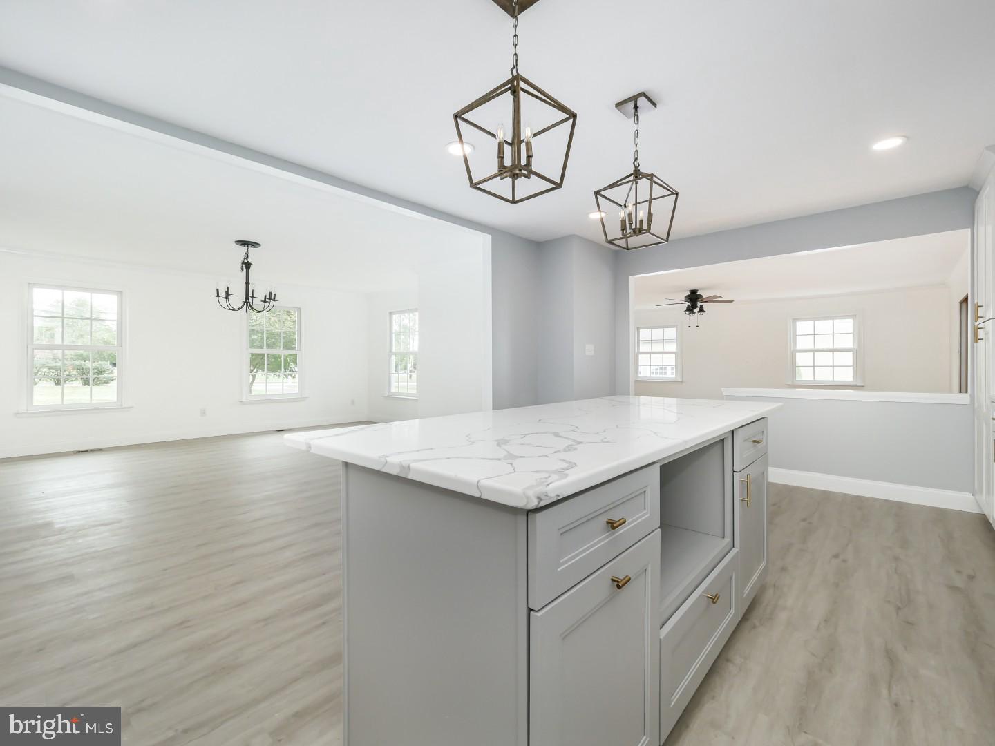 View From Kitchen into Dining and Family Rooms