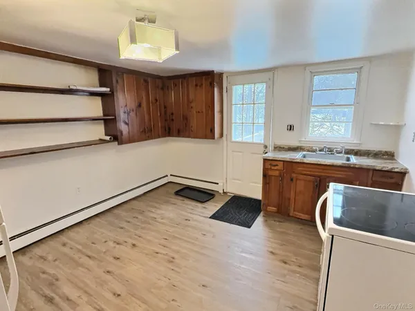 a kitchen with stainless steel appliances granite countertop a sink and a stove