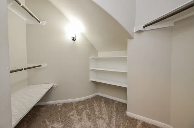 a view of an empty walk in closet