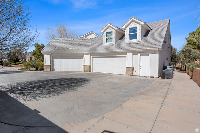 2917 Old Farm Road Washington, UT 84780 - Photo 81 of 105 View of front of house featuring concrete driveway and stone siding