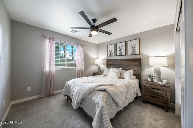 a bedroom with a bed and window