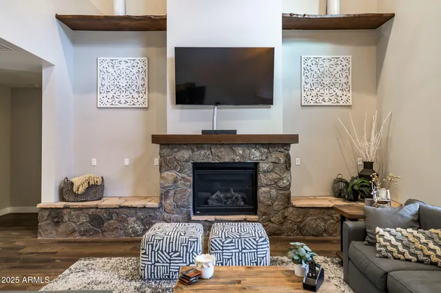 a living room with furniture and a fireplace