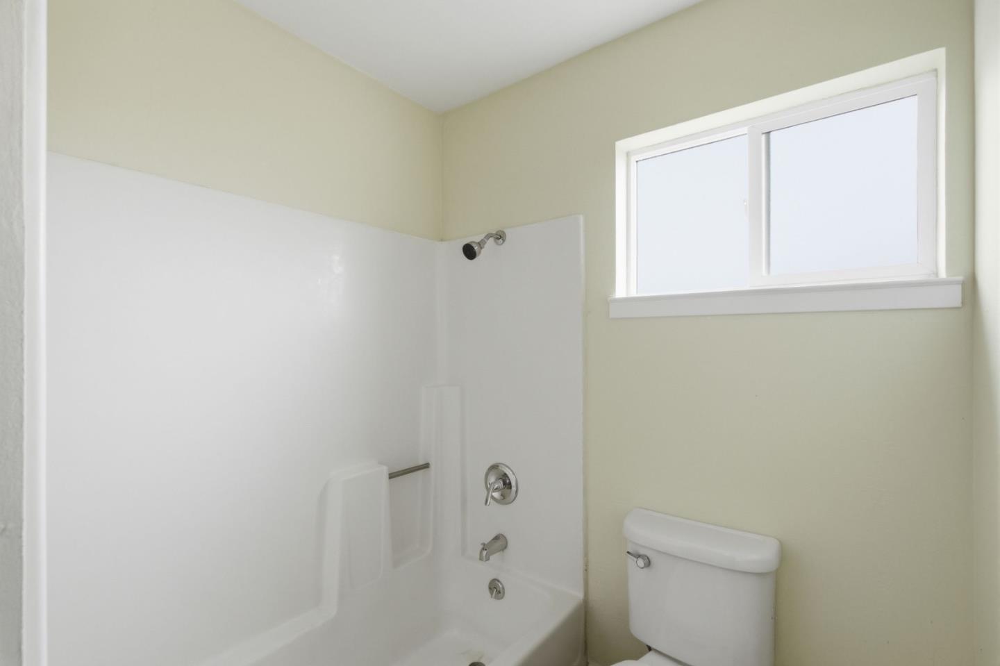 1263 Reservoir Road Pescadero, CA 94060 - Photo 61 of 66 a white toilet sitting next to a bathroom sink and vanity
