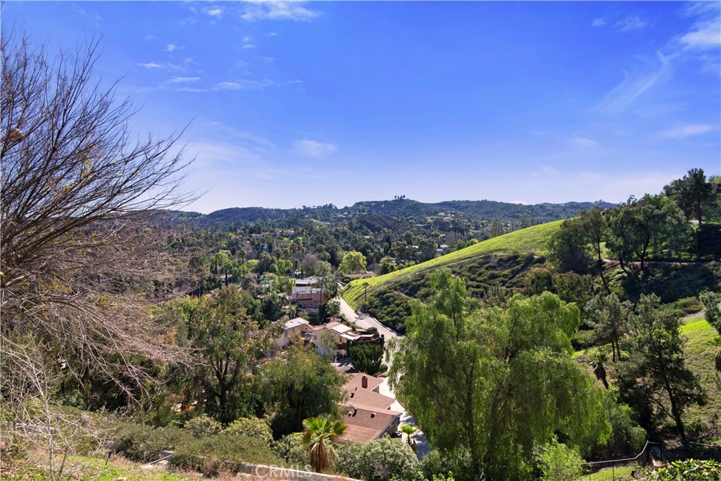 22254 Dumetz Road Woodland Hills, CA 91364 - Photo 15 of 42 a view of a city with lush green forest