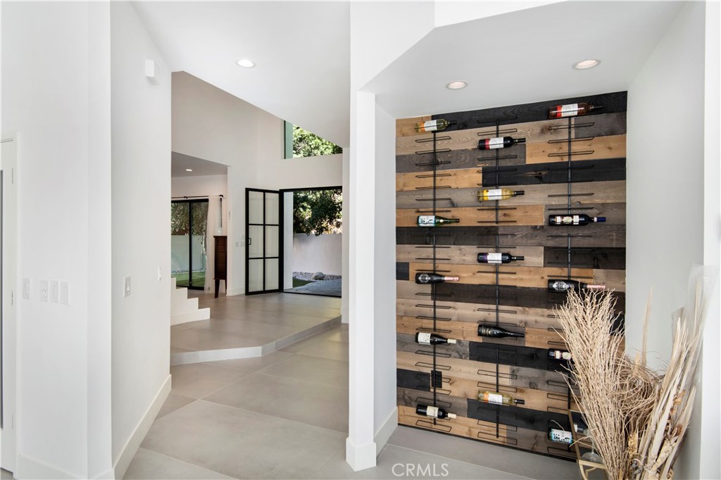 22254 Dumetz Road Woodland Hills, CA 91364 - Photo 17 of 42 a view of a hallway with shelf