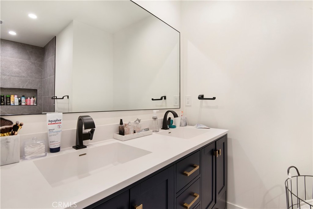 22254 Dumetz Road Woodland Hills, CA 91364 - Photo 21 of 42 a bathroom with a sink and a mirror