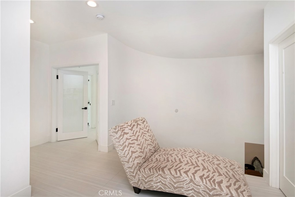 22254 Dumetz Road Woodland Hills, CA 91364 - Photo 24 of 42 a bedroom with a bed and a window