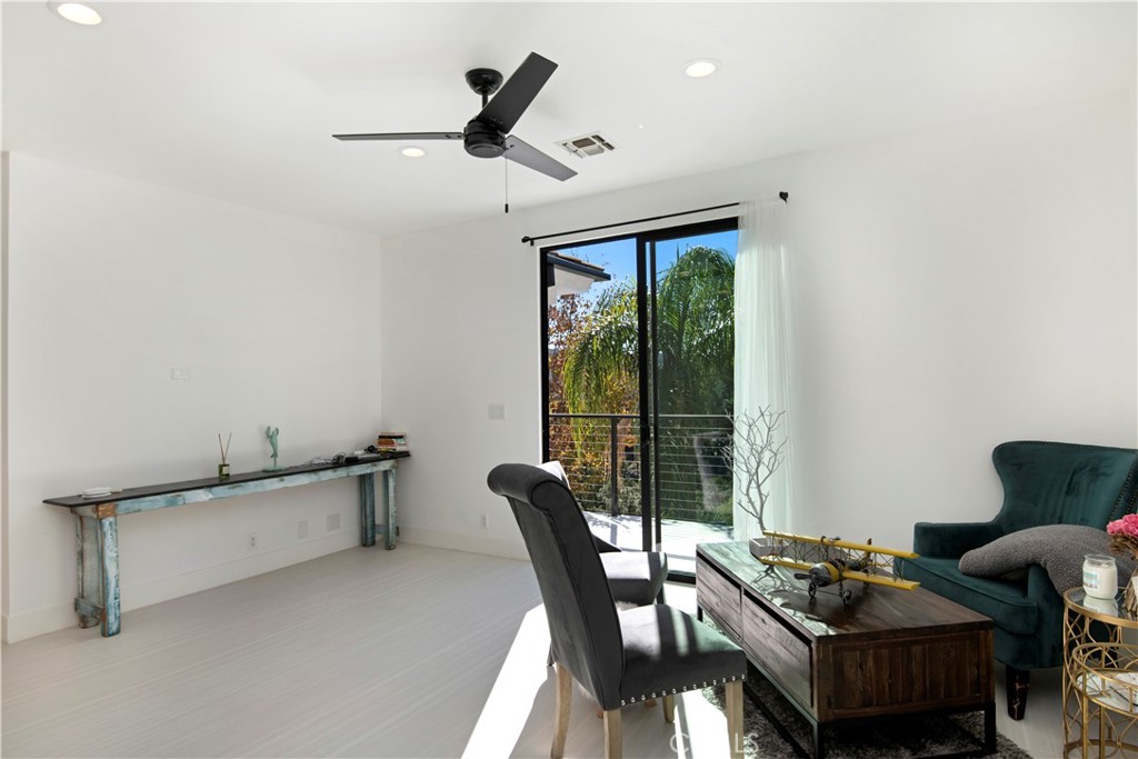 22254 Dumetz Road Woodland Hills, CA 91364 - Photo 27 of 42 a living room with furniture and a window