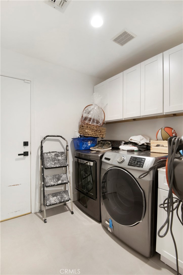 22254 Dumetz Road Woodland Hills, CA 91364 - Photo 36 of 42 a utility room with dryer and washer