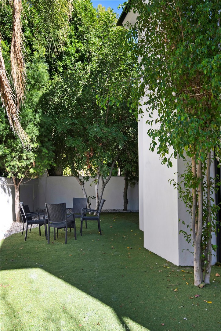 22254 Dumetz Road Woodland Hills, CA 91364 - Photo 37 of 42 a view of a house with a backyard