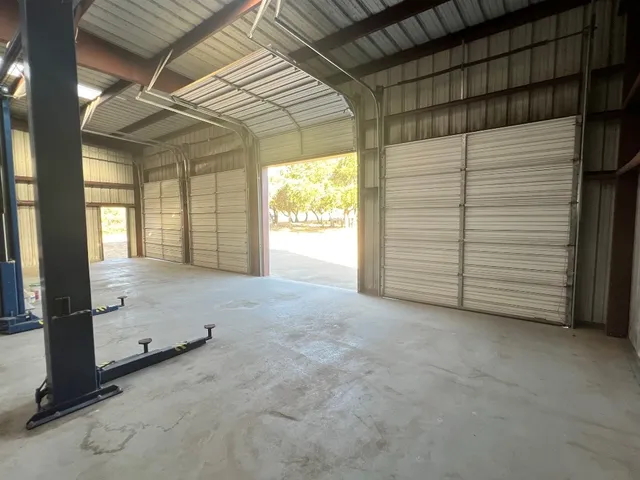 a view of an empty room with a fireplace