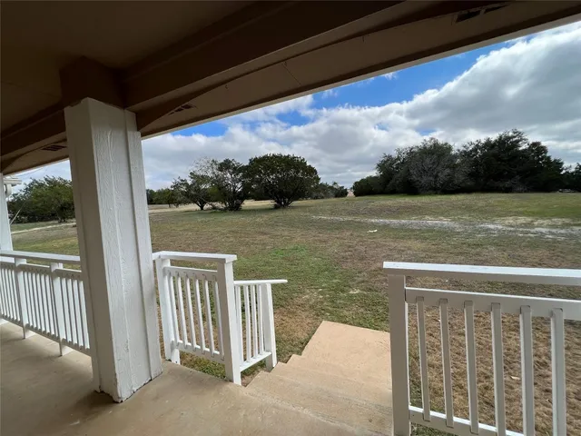 a view of a lake from a balcony