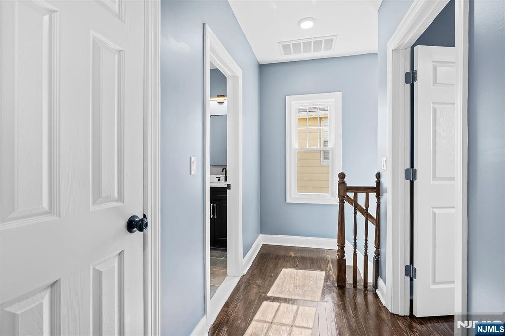 255 Garibaldi Avenue Lodi, NJ 07644 - Photo 16 of 34 a view of a hallway with a livingroom and a dinning room