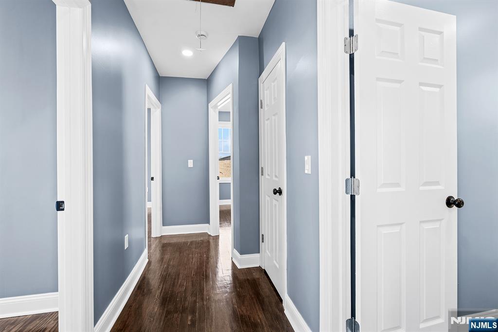 255 Garibaldi Avenue Lodi, NJ 07644 - Photo 17 of 34 a view of a hallway with wooden floor