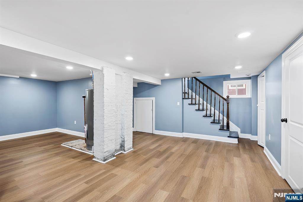 255 Garibaldi Avenue Lodi, NJ 07644 - Photo 25 of 34 a view of an empty room with wooden floor