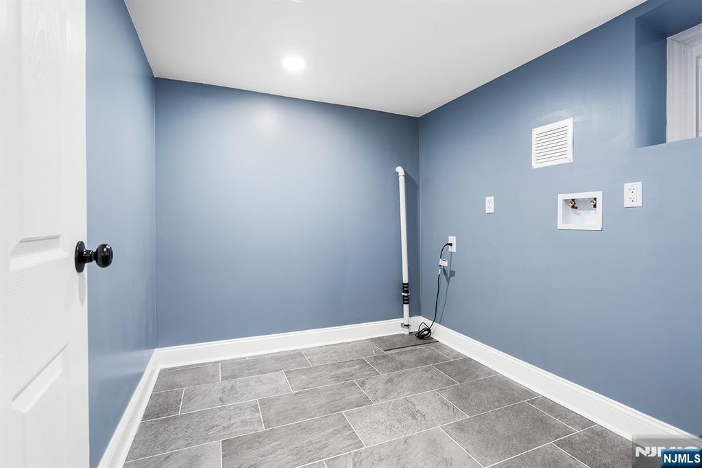 255 Garibaldi Avenue Lodi, NJ 07644 - Photo 26 of 34 a view of a livingroom with a hallway