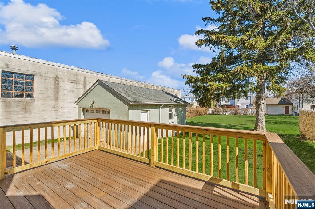 255 Garibaldi Avenue Lodi, NJ 07644 - Photo 28 of 34 a view of a wooden deck with a yard