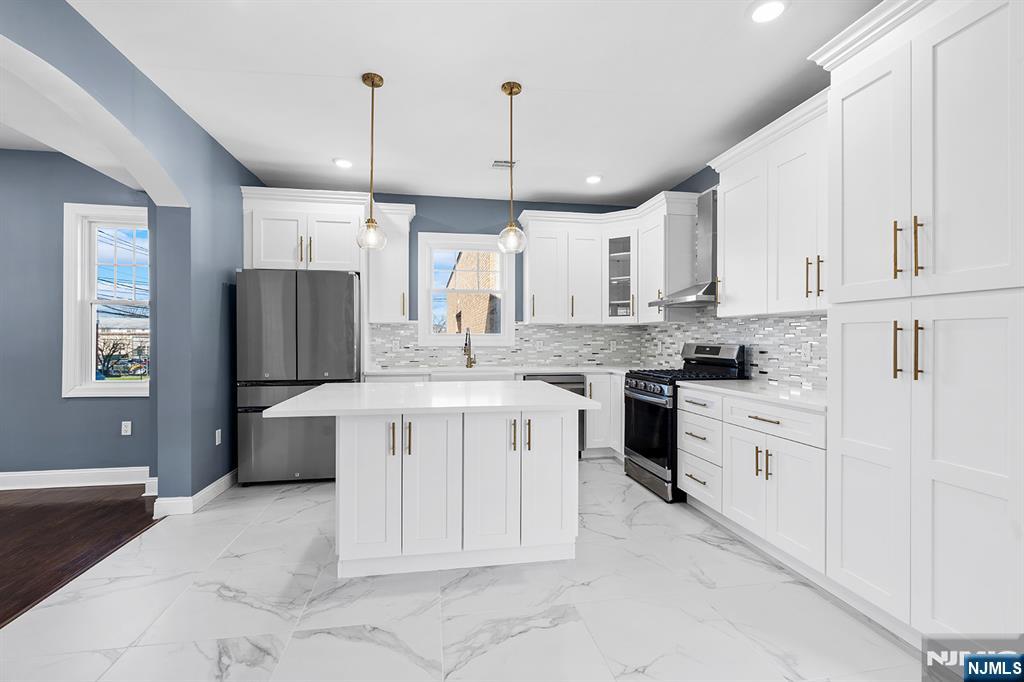 255 Garibaldi Avenue Lodi, NJ 07644 - Photo 4 of 34 a kitchen with cabinets appliances and a window