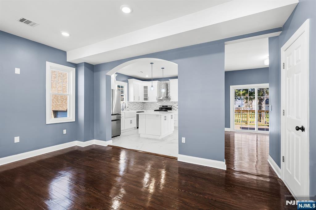 255 Garibaldi Avenue Lodi, NJ 07644 - Photo 6 of 34 a view of a kitchen with wooden floor and a window