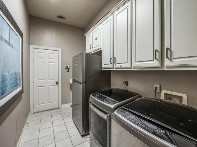 a kitchen with a stove and a refrigerator