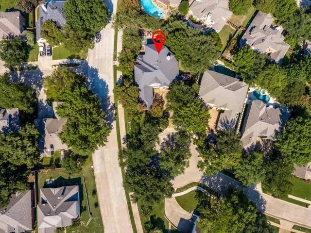 an aerial view of a house with outdoor space