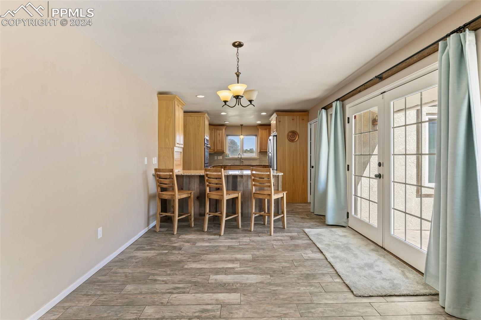 3830 Range View Road Monument, CO 80132 - Photo 19 of 50 Kitchen - French doors on right lead to front patio.