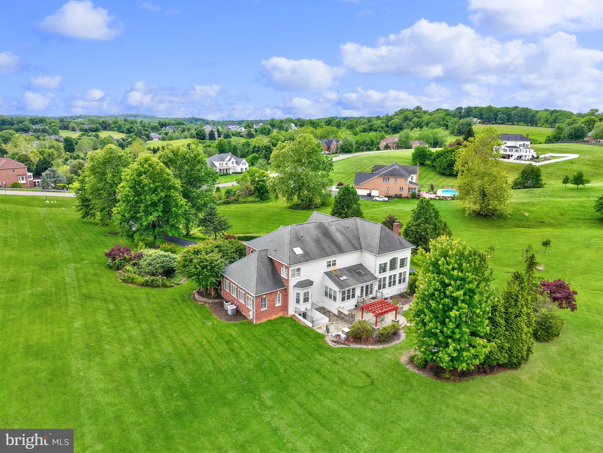 40890 Beechnut Road Leesburg, VA 20175 - Photo 59 of 65 a view of a garden with a building in the background
