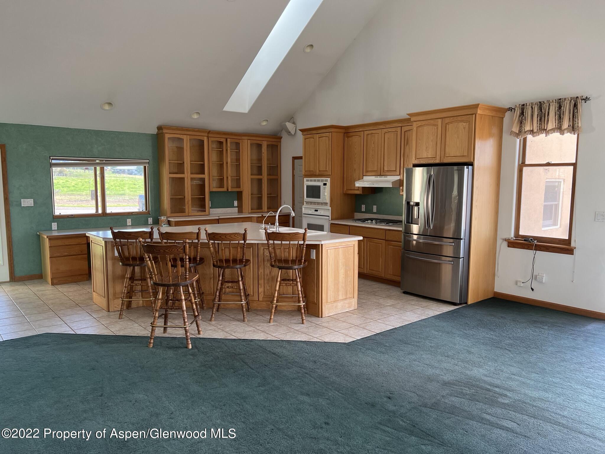 248 Fox Run Road Rifle, CO 81650 - Photo 5 of 14 a living room with stainless steel appliances kitchen island granite countertop furniture and a dining table