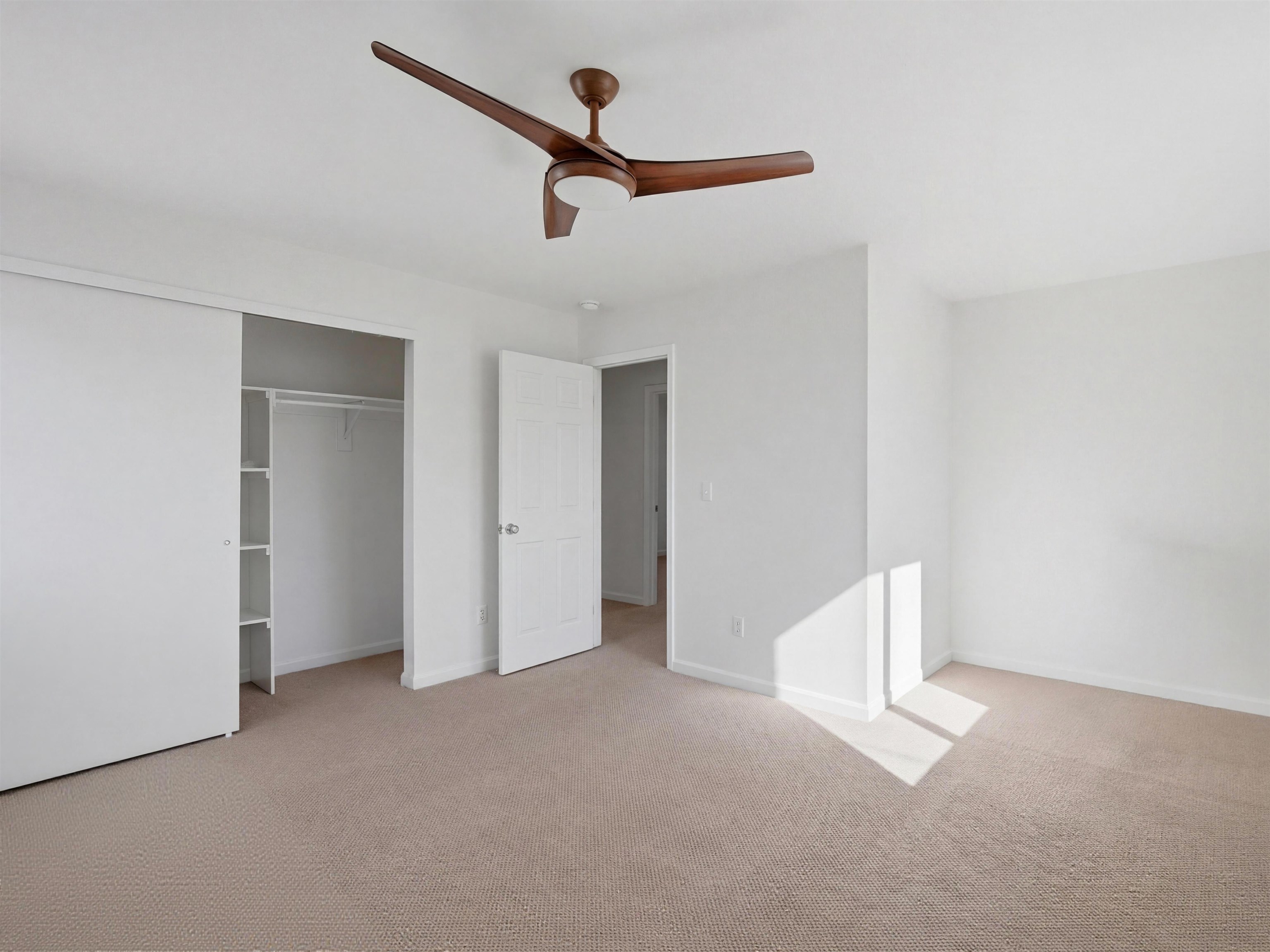 252 South Peach Street Fruita, CO 81521 - Photo 13 of 22 a view of empty room with ceiling fan