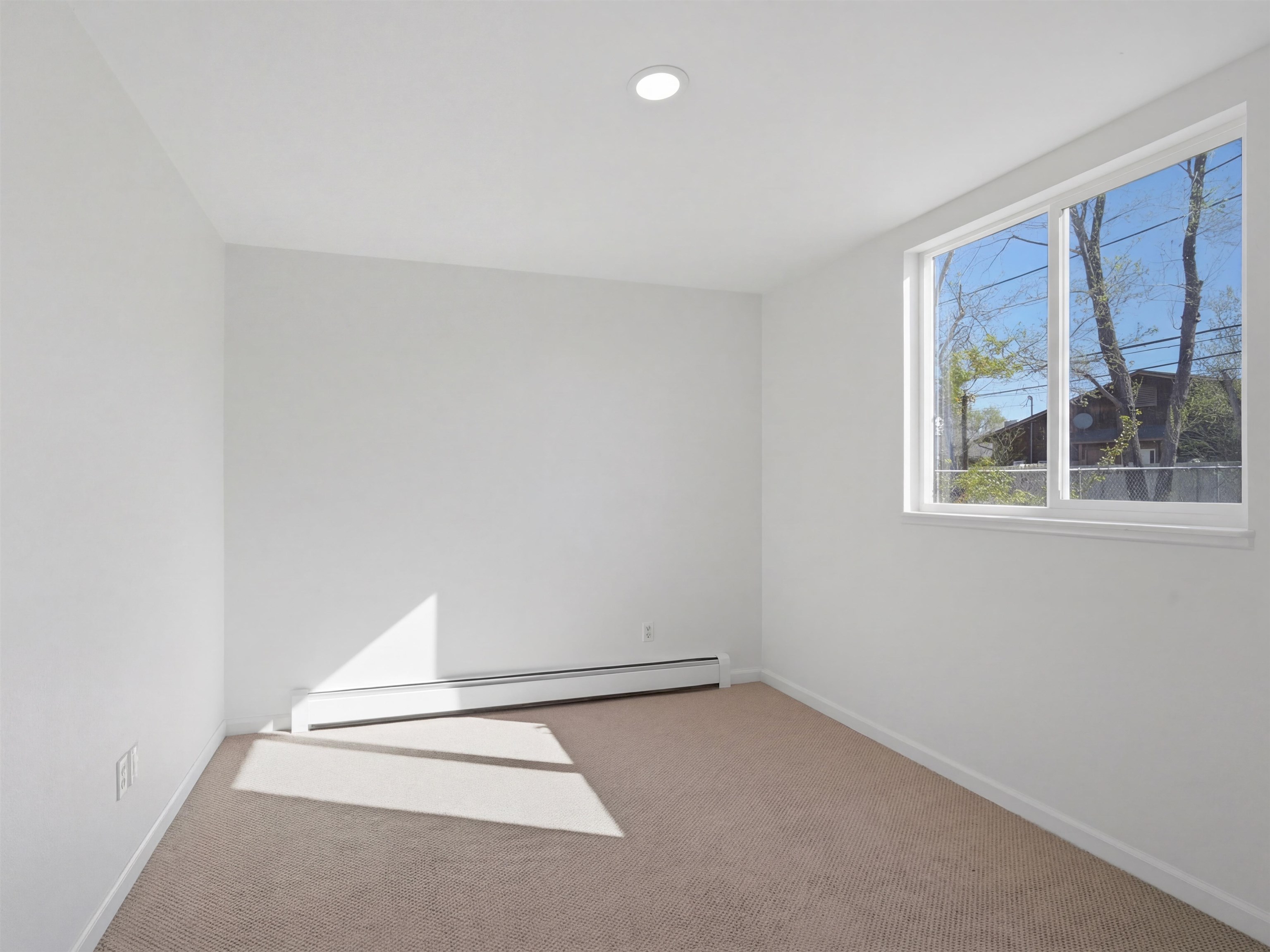 252 South Peach Street Fruita, CO 81521 - Photo 16 of 22 an empty room with a window