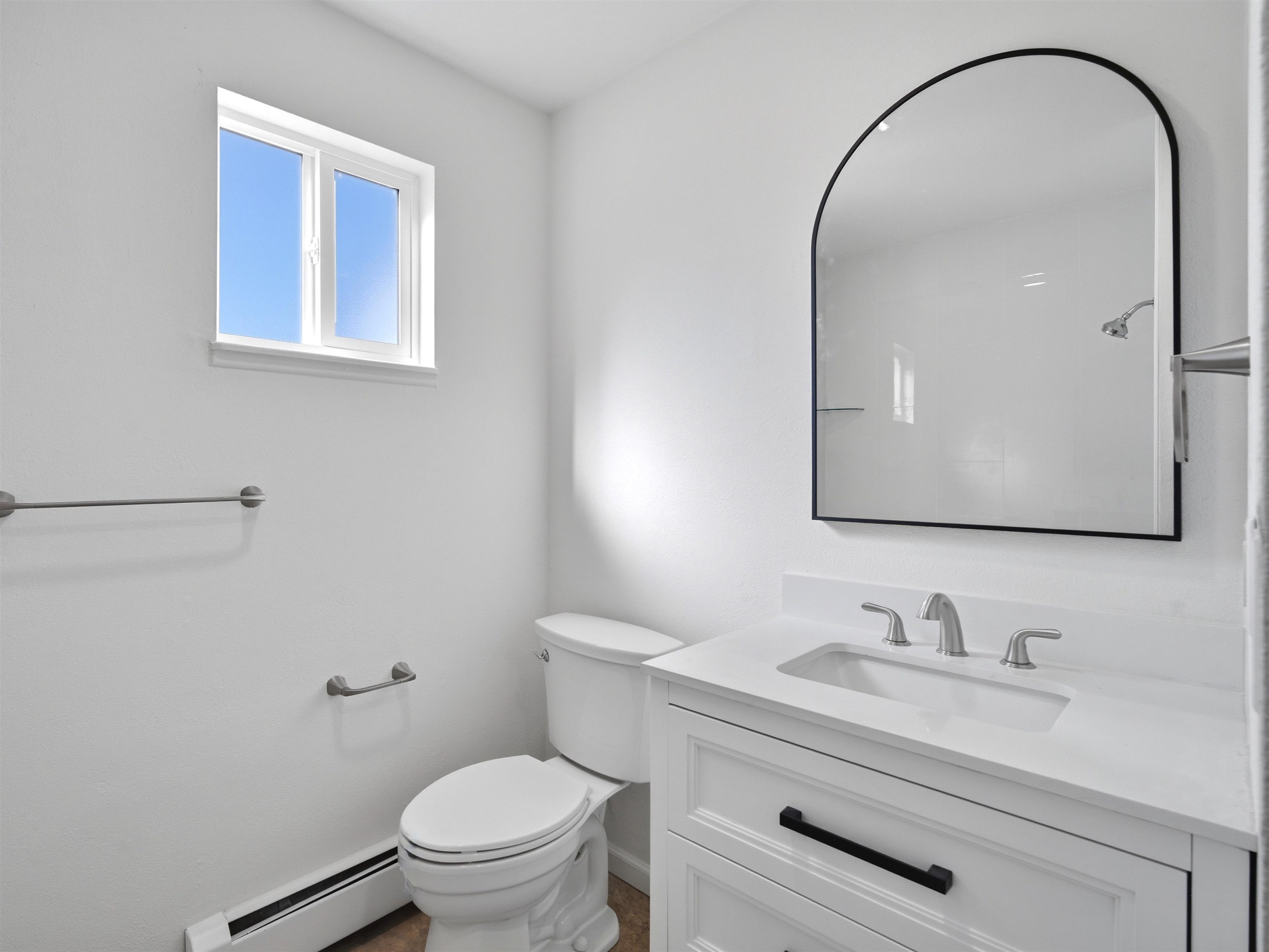 252 South Peach Street Fruita, CO 81521 - Photo 18 of 22 a bathroom with a granite countertop sink mirror and toilet