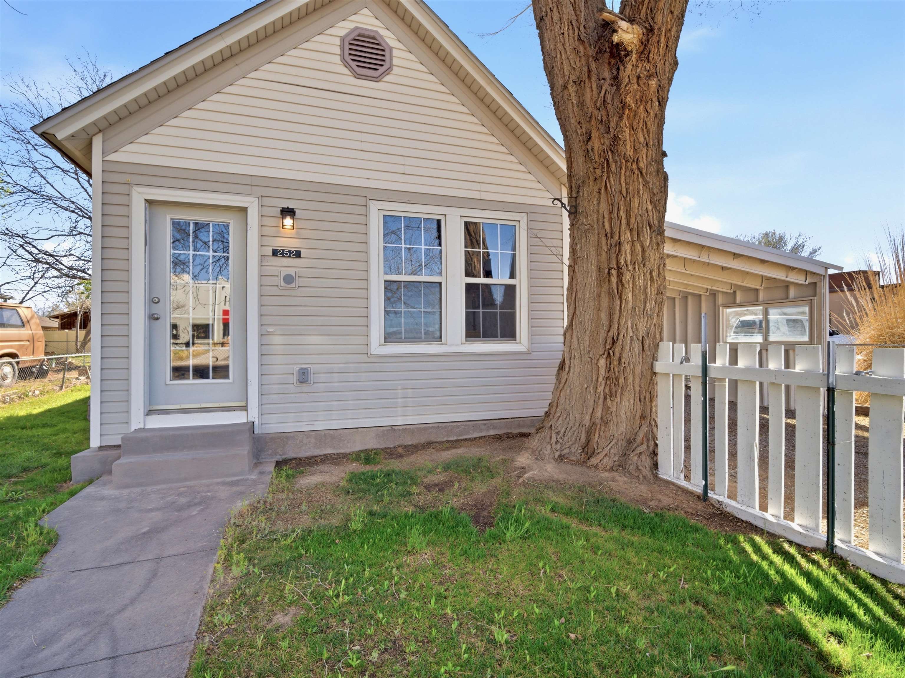 252 South Peach Street Fruita, CO 81521 - Photo 2 of 22 a view of a house with a yard